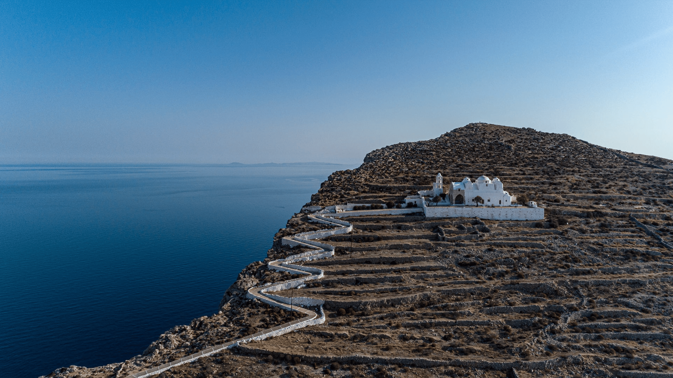 A dried flower rested upon wrinkled pieces of cloth paper.